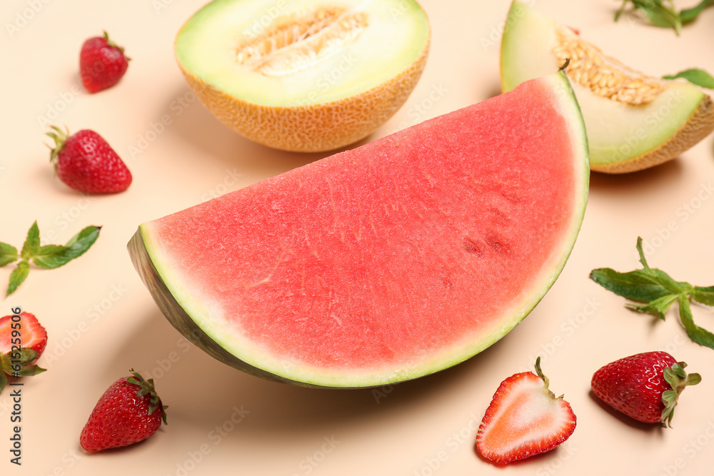 Piece of fresh watermelon and different berries on orange background