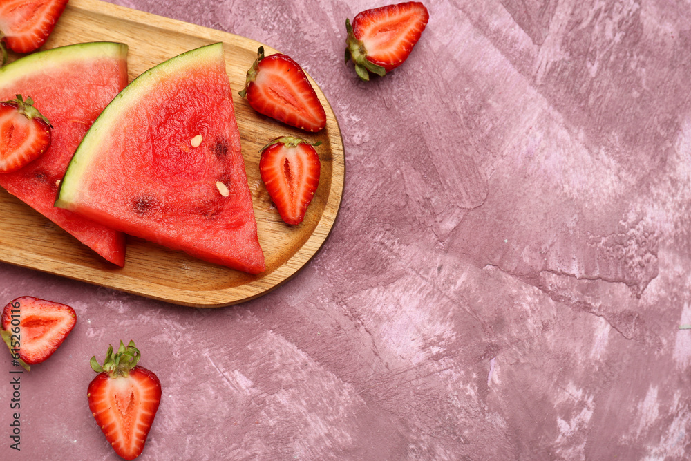 Board with pieces of fresh watermelon and strawberries on purple background