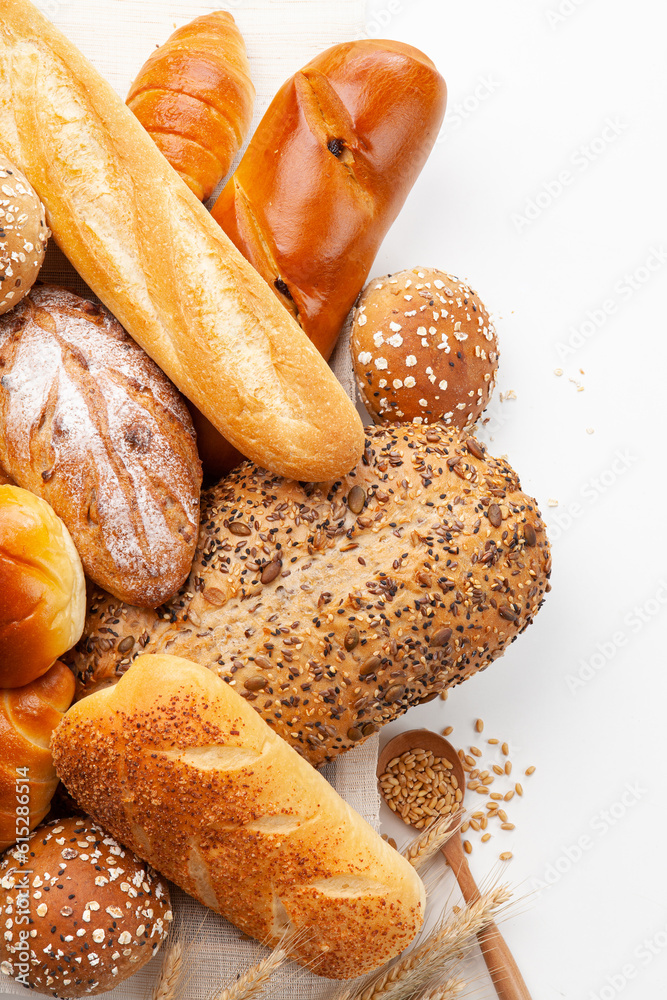 various kinds of breads on white background. top view.