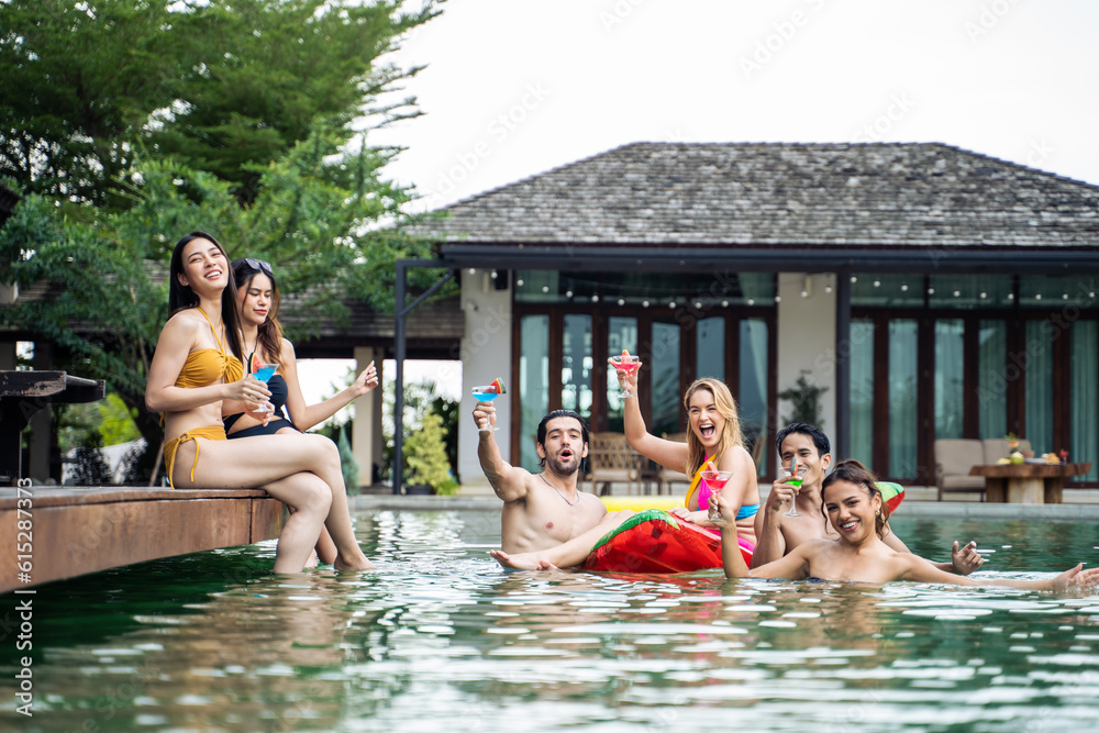 Group of diverse friend drinking alcohol, having a pool party together. 