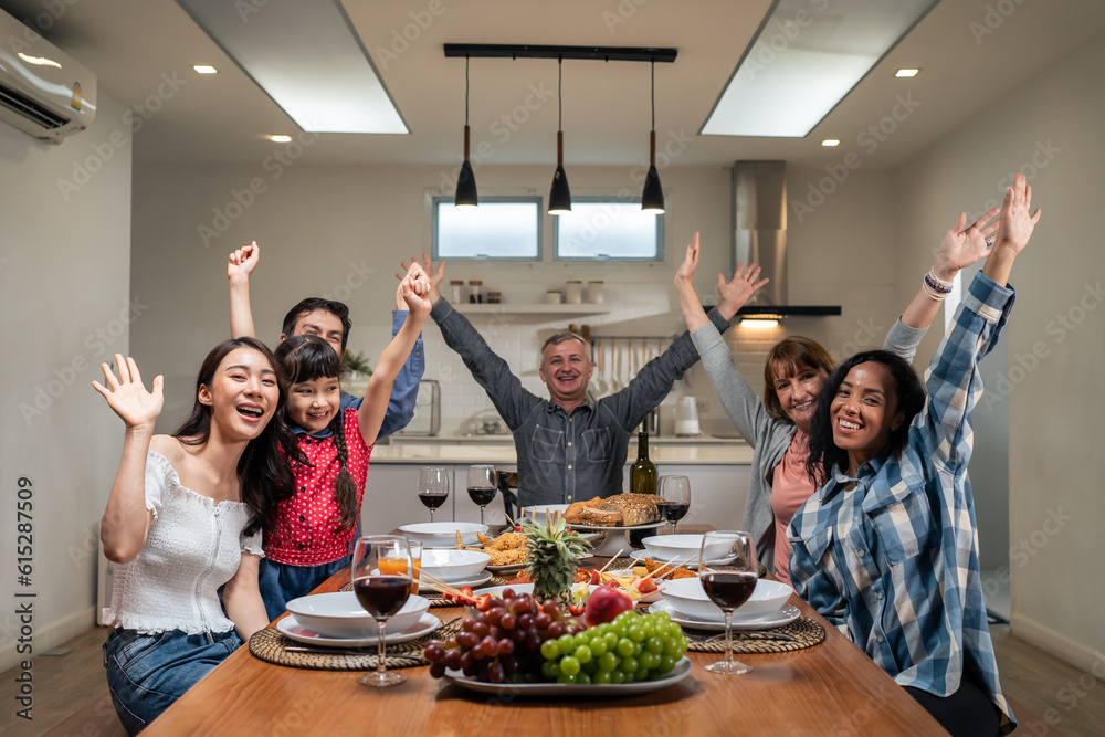 Portrait of Multi-ethnic family having evening dinner party in house. 