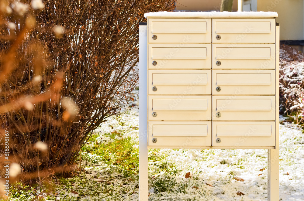 View of mailboxes in city on winter day