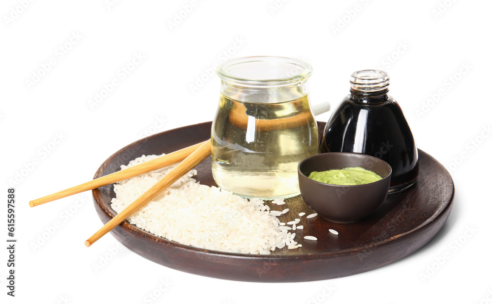 Plate with rice, vinegar, soy sauce and wasabi on white background