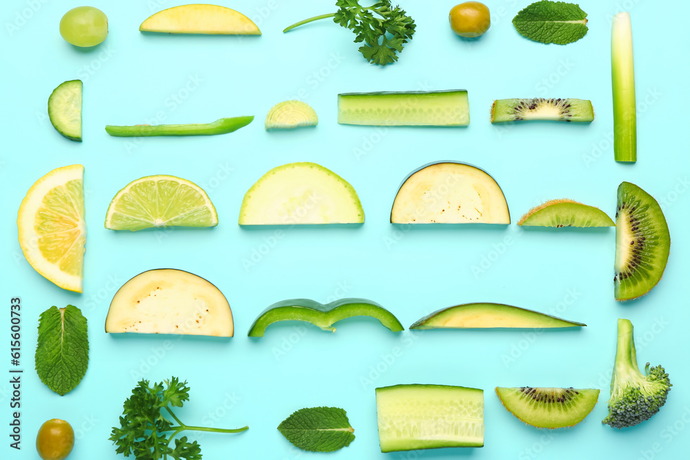 Composition with fresh fruits and vegetables on turquoise background