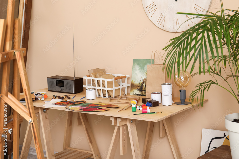 Table with artists supplies in studio