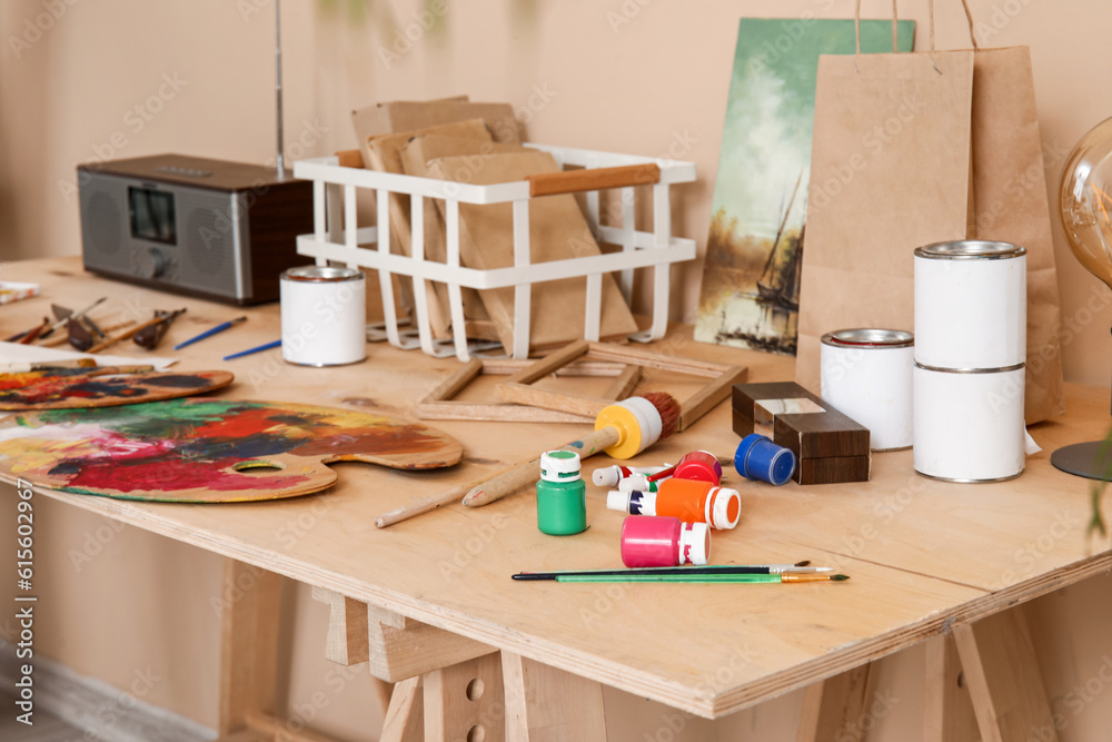 Table with artists supplies in studio