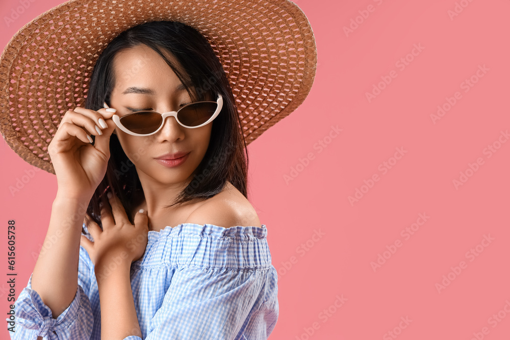 Beautiful Asian woman in stylish sunglasses on pink background, closeup