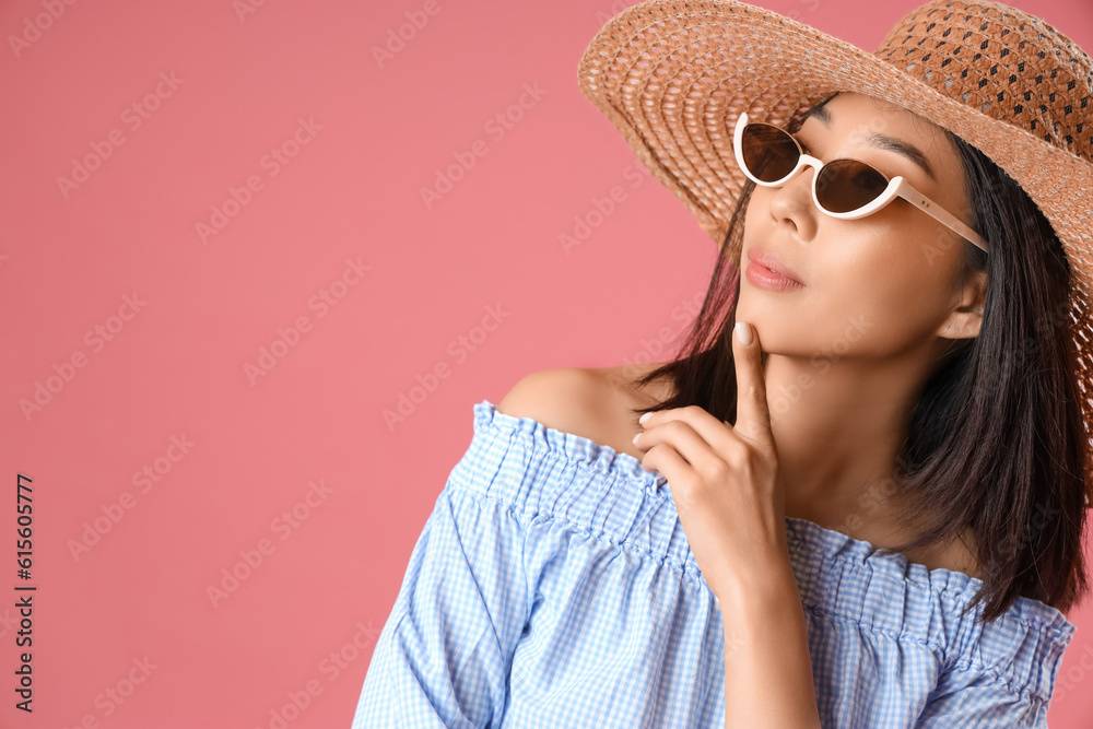 Beautiful Asian woman in stylish sunglasses on pink background, closeup