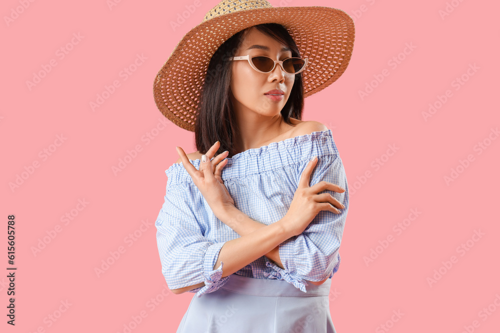 Beautiful Asian woman in stylish sunglasses on pink background