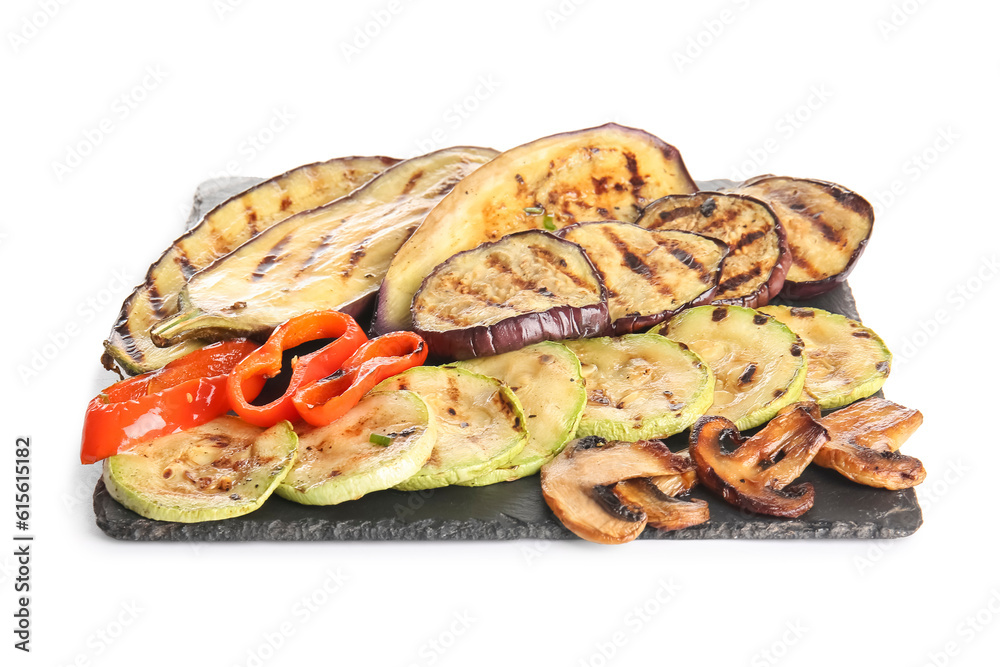 Slate board with different tasty grilled vegetables on white background