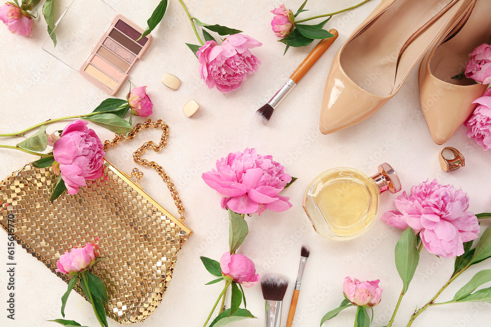 Composition with female accessories, cosmetics, high heels and beautiful peony flowers on light back