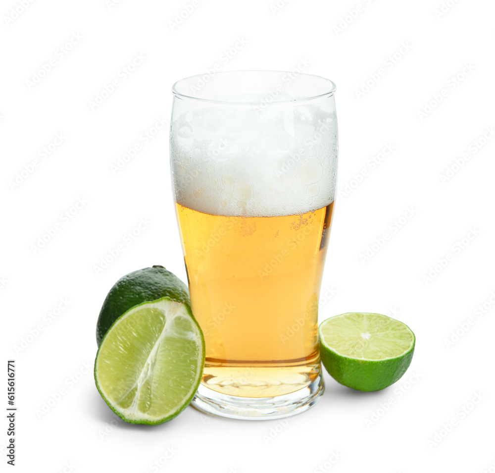 Glass of cold beer with lime on white background