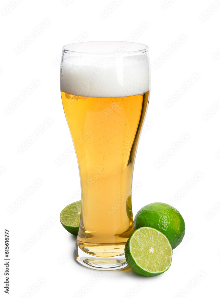 Glass of cold beer with lime on white background