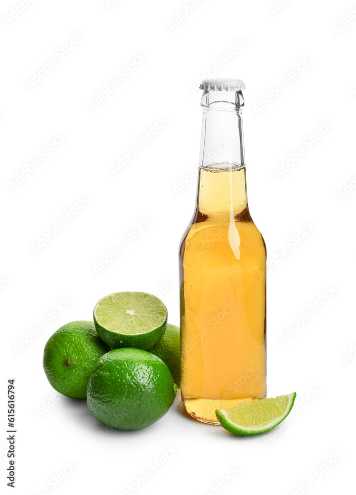 Bottle of cold beer with lime on white background