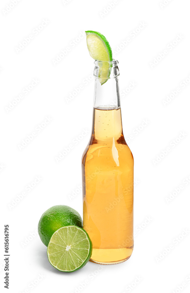 Bottle of cold beer with lime on white background