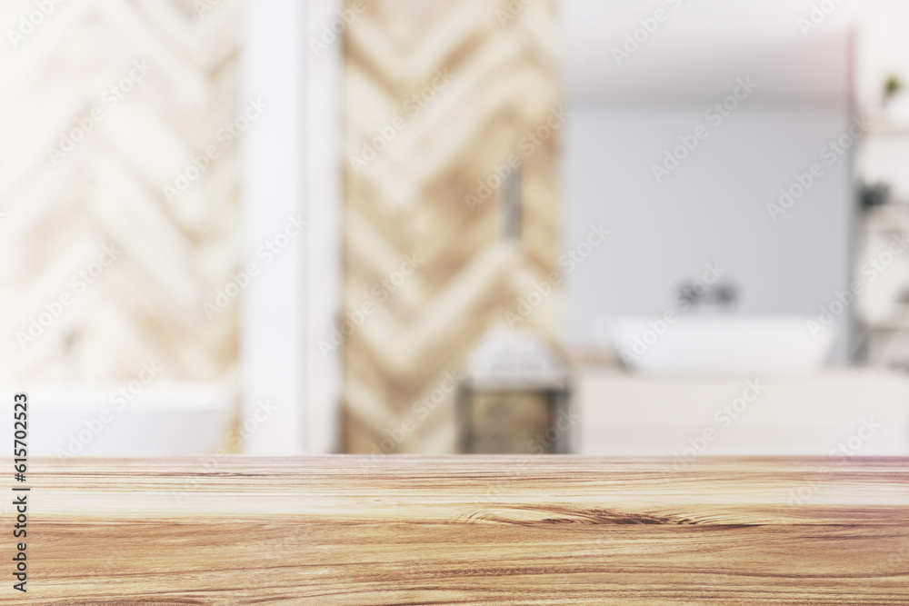 Front view of empty wooden table top in bathroom interior with blurred background, product presentat