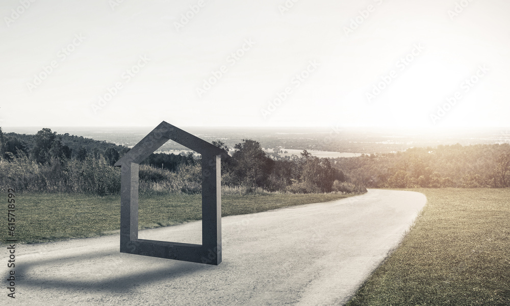 Conceptual background image of concrete home sign on asphalt road