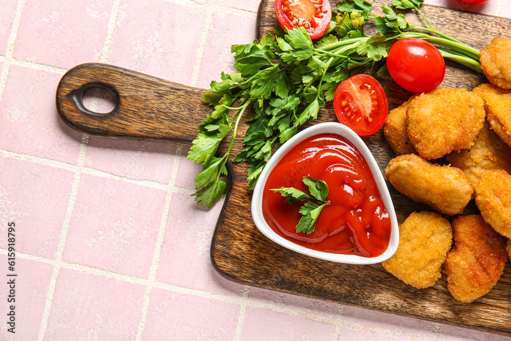 Board with delicious nuggets, bowl of ketchup and parsley on pink tiled table