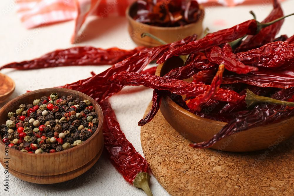 Composition with dry hot chili peppers and spices on white background