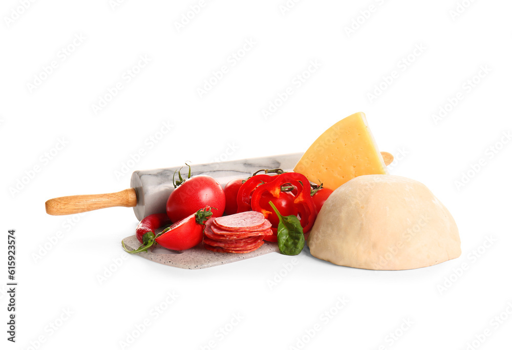 Raw dough and ingredients for preparing pizza on white background