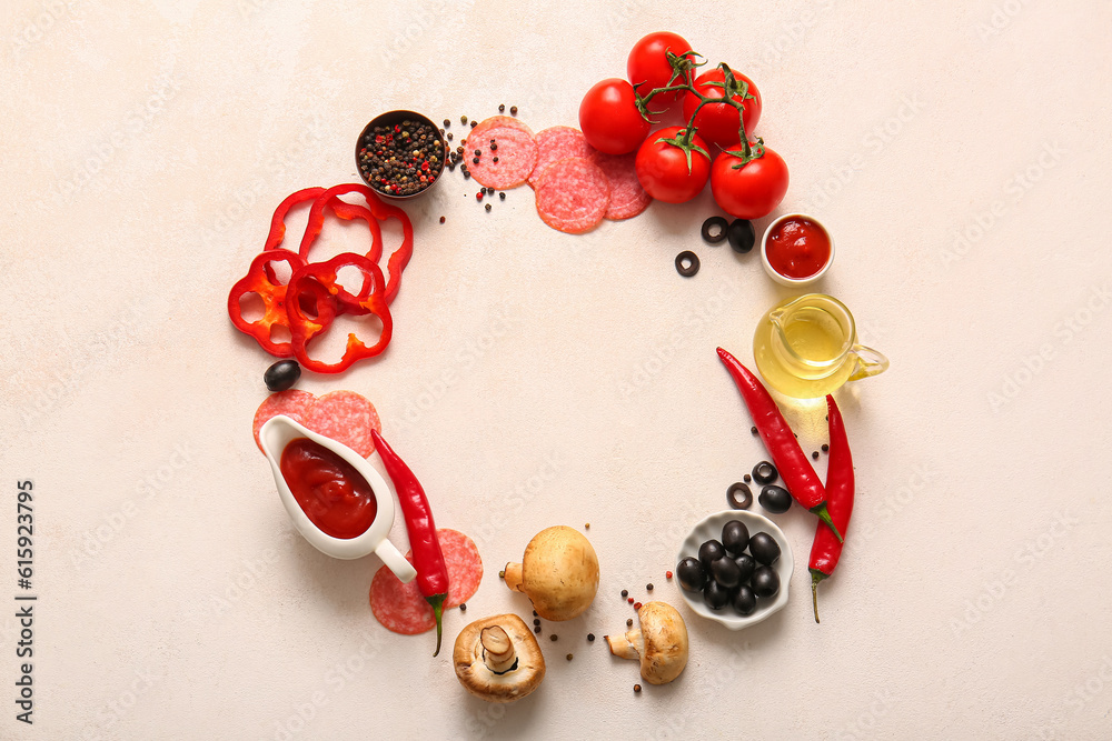 Frame made of fresh ingredients for preparing pizza on light background