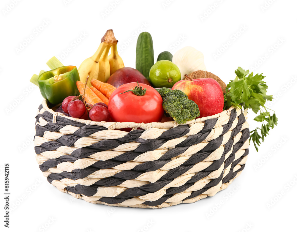 Wicker bowl with different fresh fruits and vegetables on white background