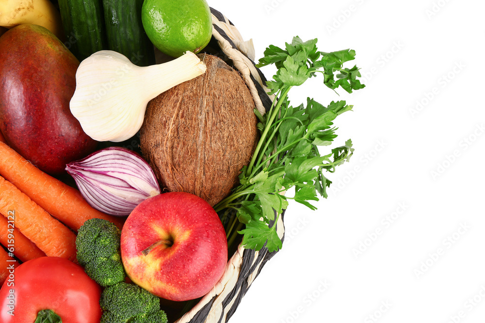 Wicker bowl with different fresh fruits and vegetables on white background, closeup