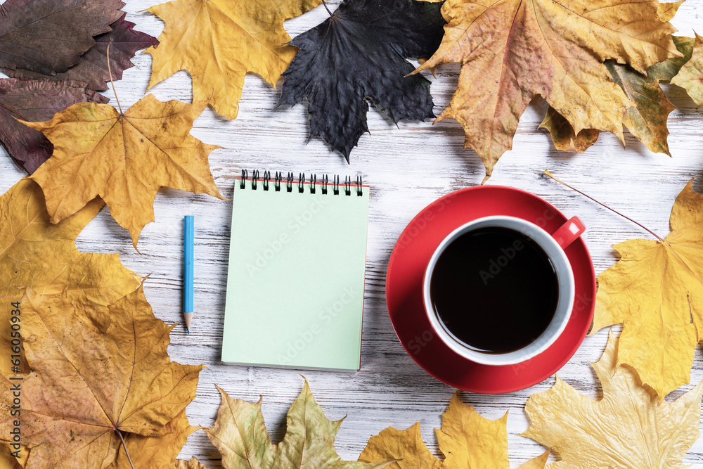 Flat lay autumn composition with cup of black tea