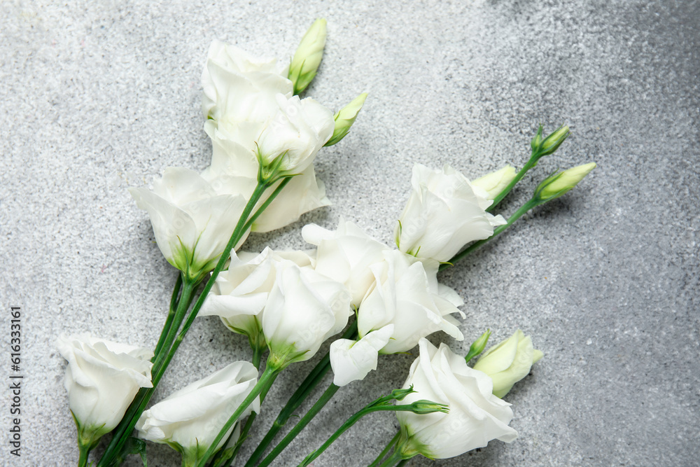 Beautiful eustoma flowers on black and white background, closeup