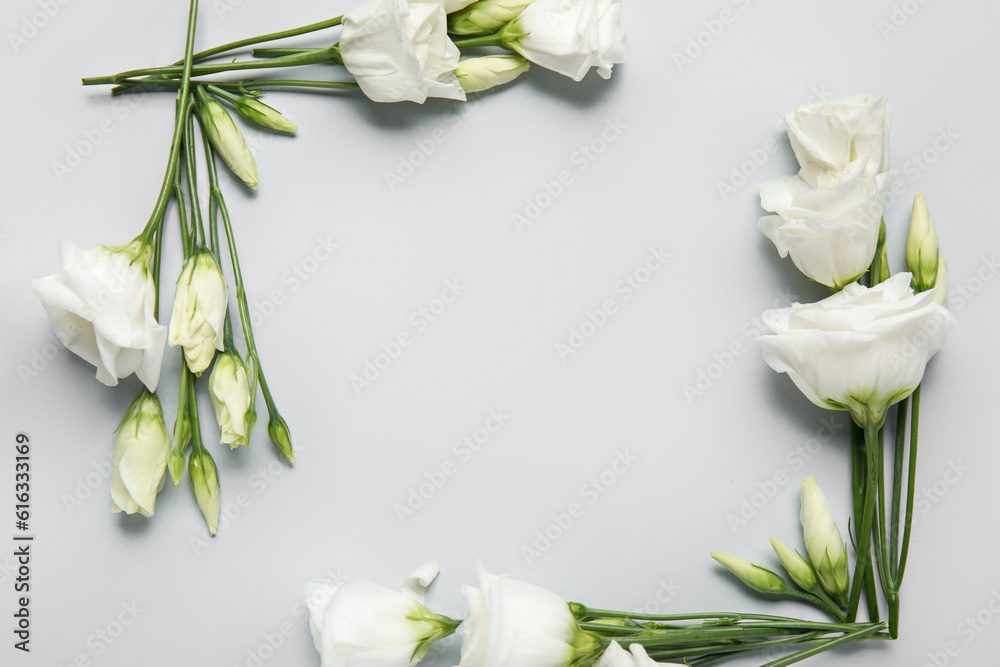 Composition with beautiful eustoma flowers on light background