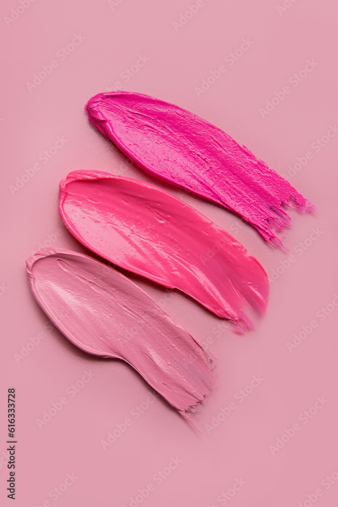 Lipstick strokes on pink background