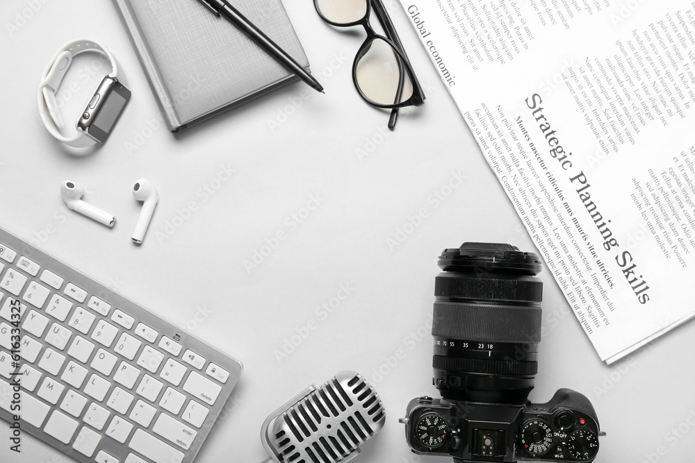 Frame made of journalists equipment on light background