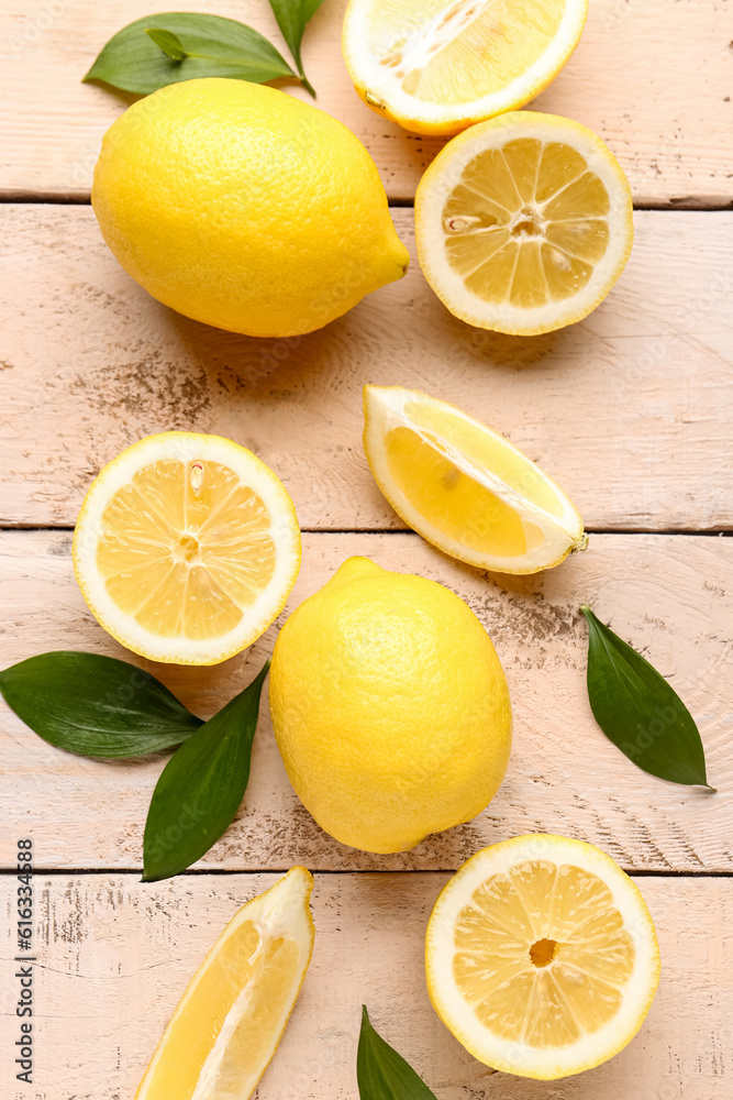 Fresh lemons on white wooden background