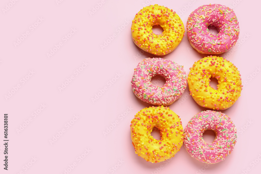 Sweet donuts on pink background