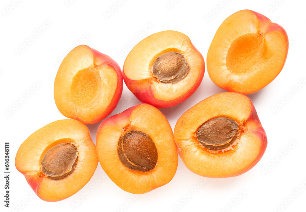 Halves of ripe apricot isolated on white background