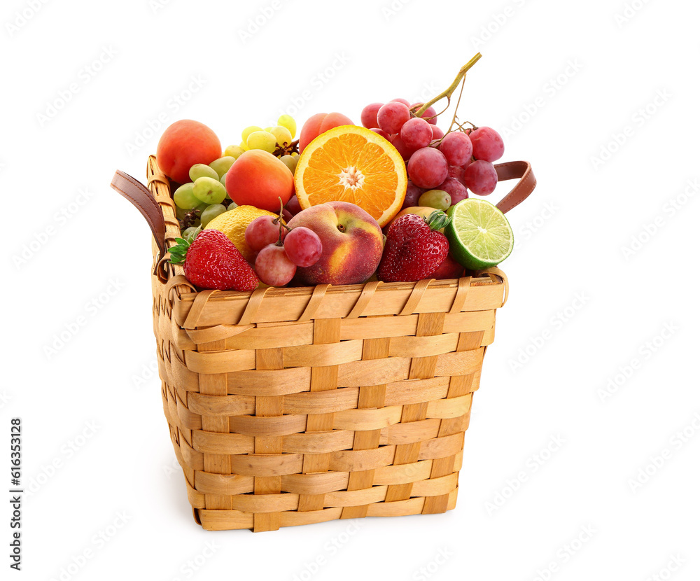 Wicker basket with different fresh fruits on white background