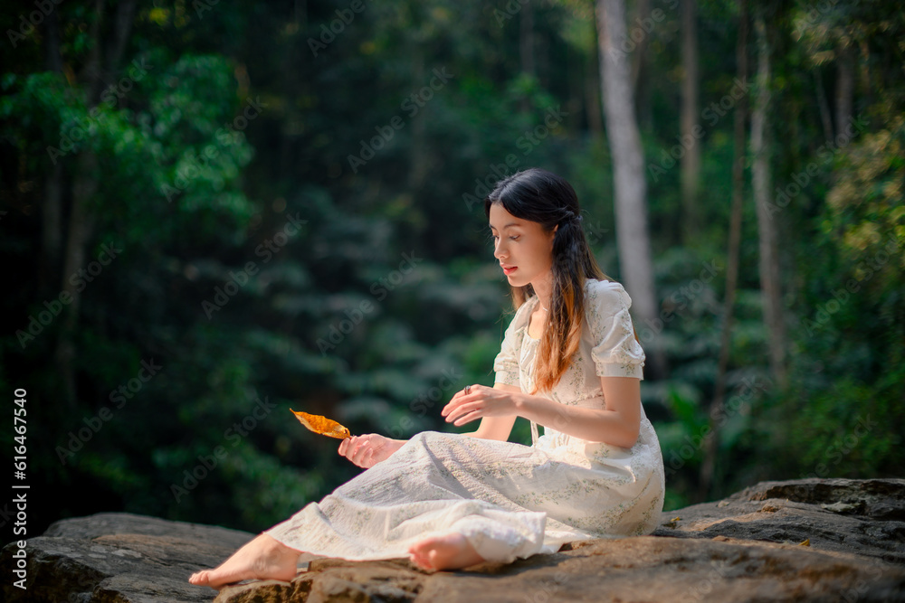 beautiful woman in white dress in deep forest, elf princess fairy tale concept