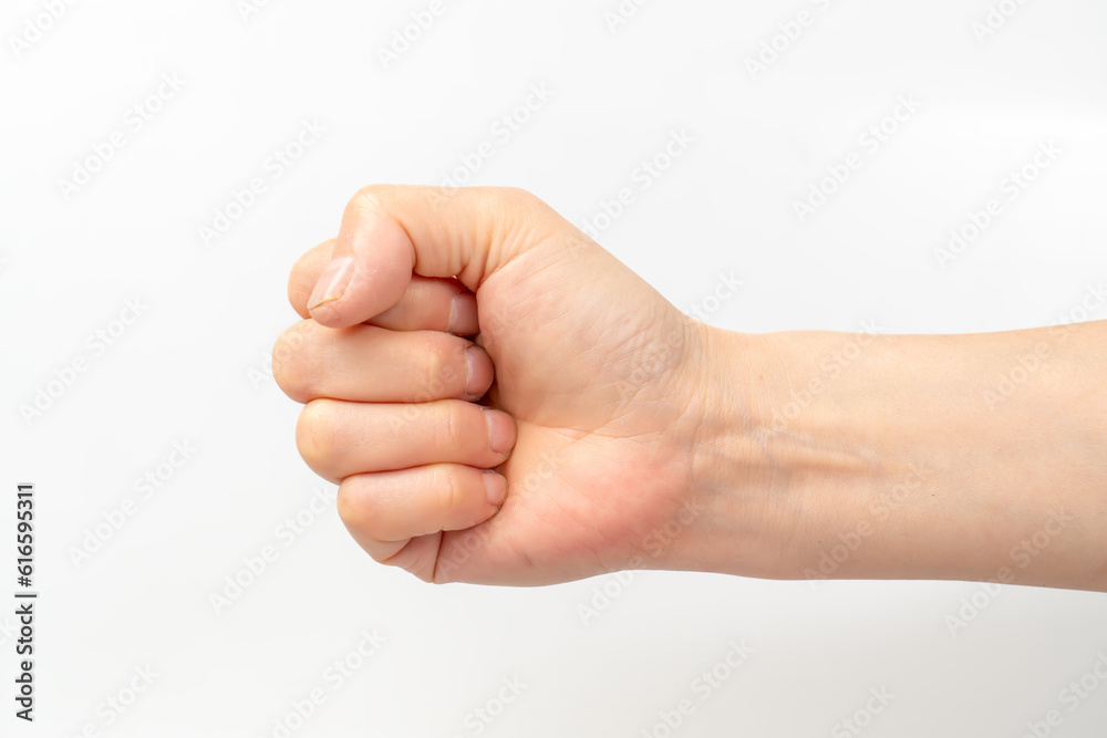 Close-up of beautiful womans hand isolated on white background.