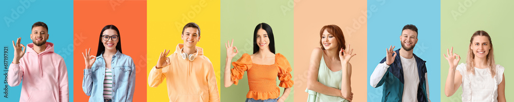 Group of young people showing OK gesture on color background