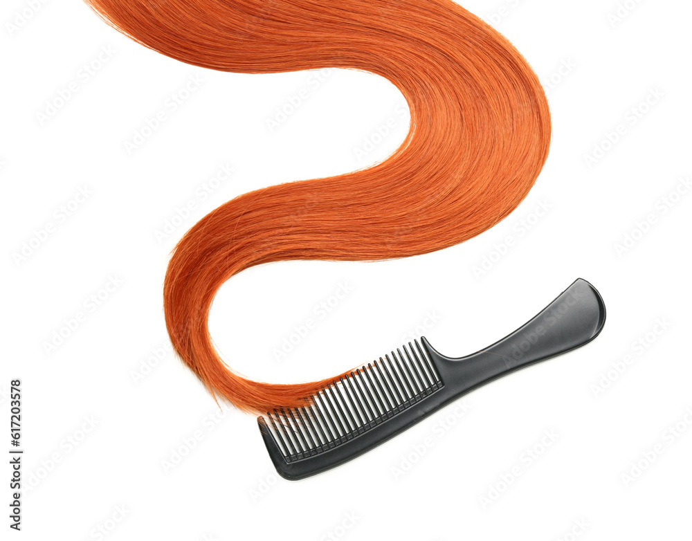 Ginger hair strand and comb on white background, closeup