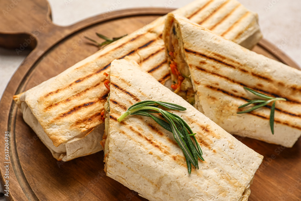 Board with tasty shawarma and rosemary, closeup