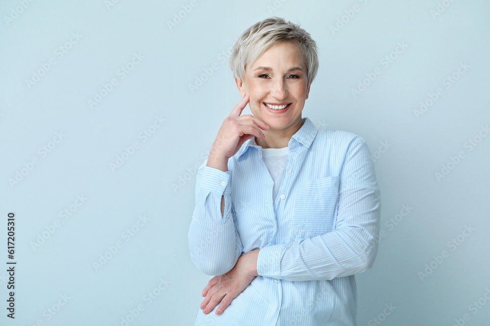 Beautiful mature woman on light background