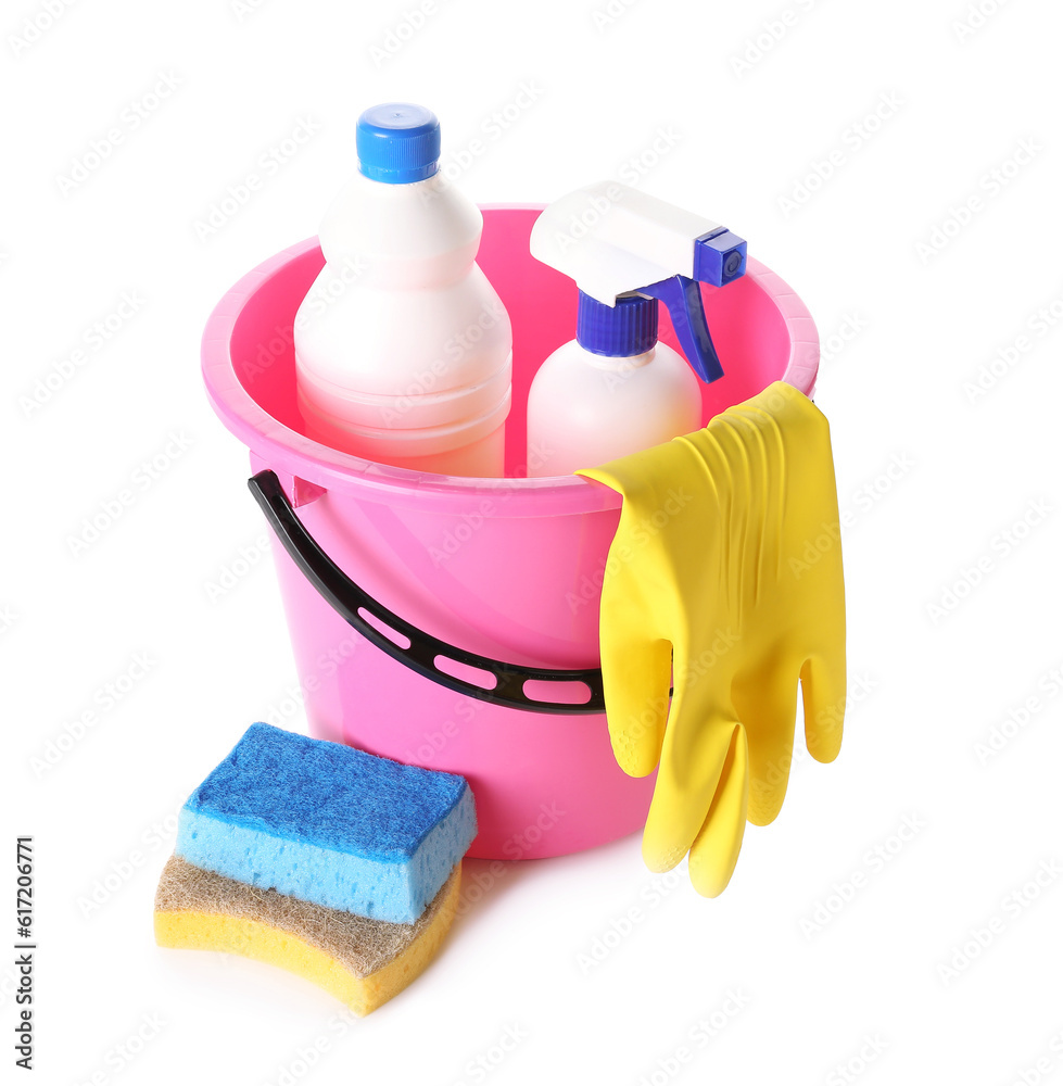 Bucket with different cleaning supplies on white background