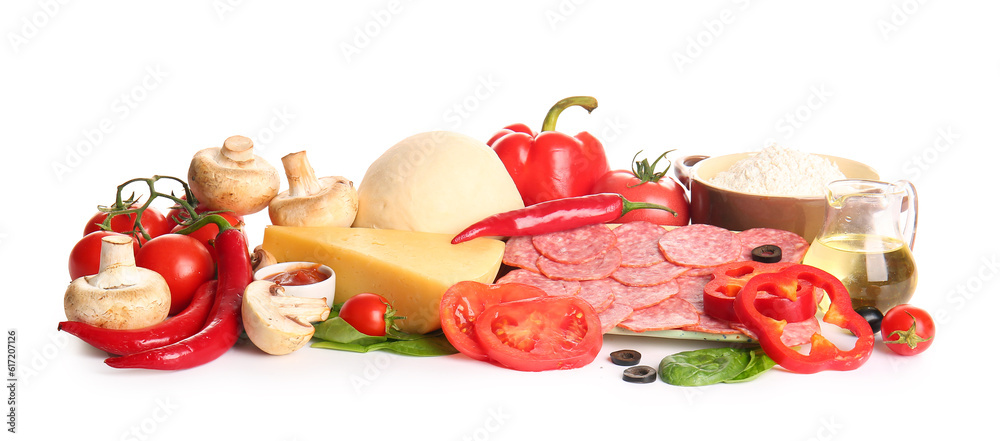 Raw dough and ingredients for preparing pizza on white background