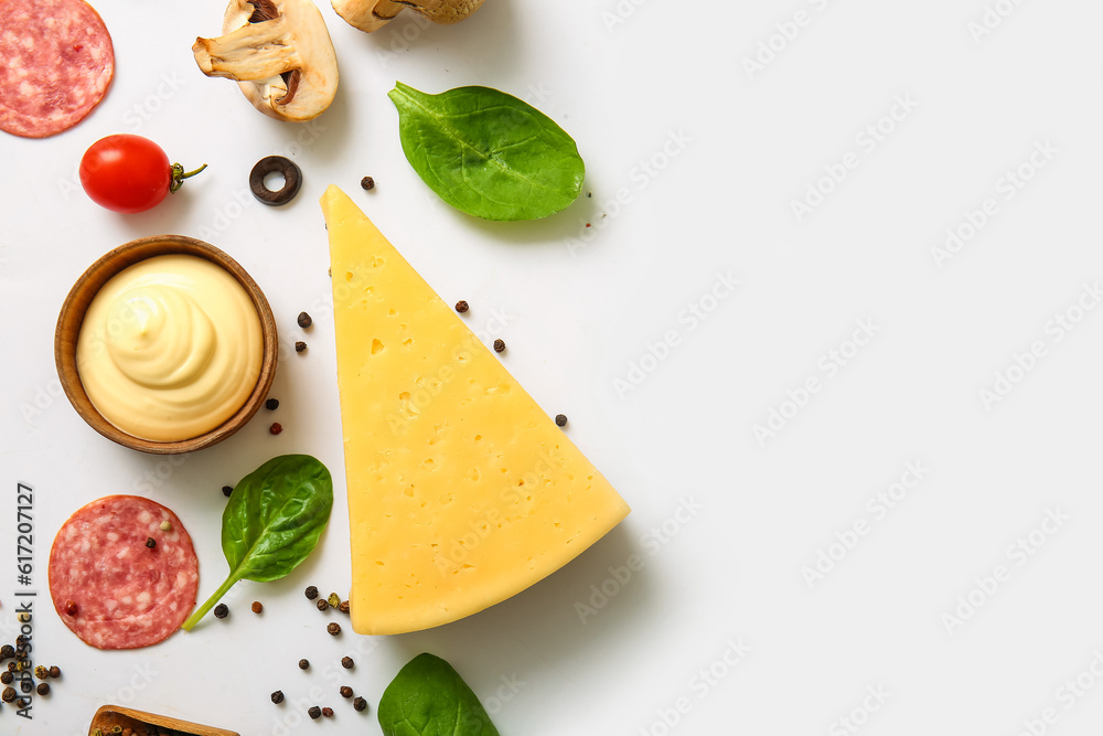 Fresh ingredients for preparing pizza on white background