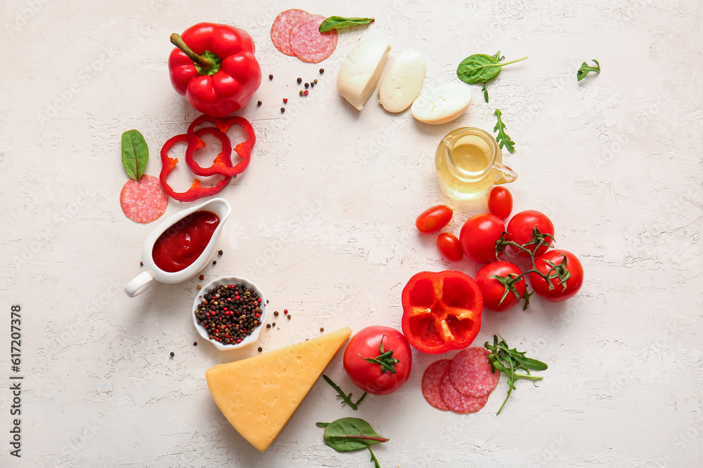 Frame made of ingredients for preparing pizza on light background