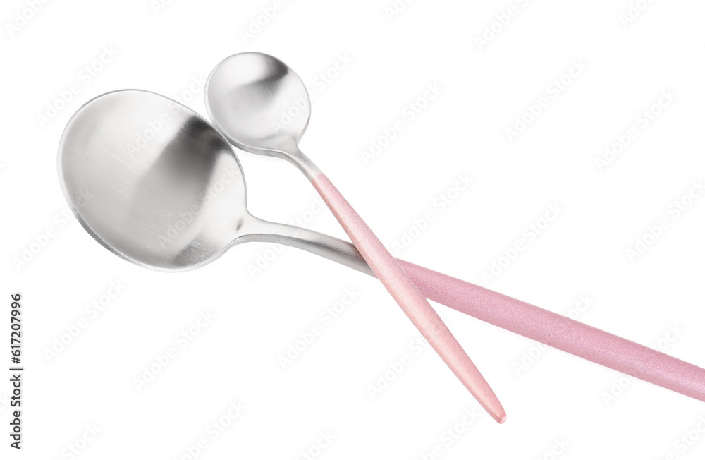 Stainless steel spoons with pink handles on white background