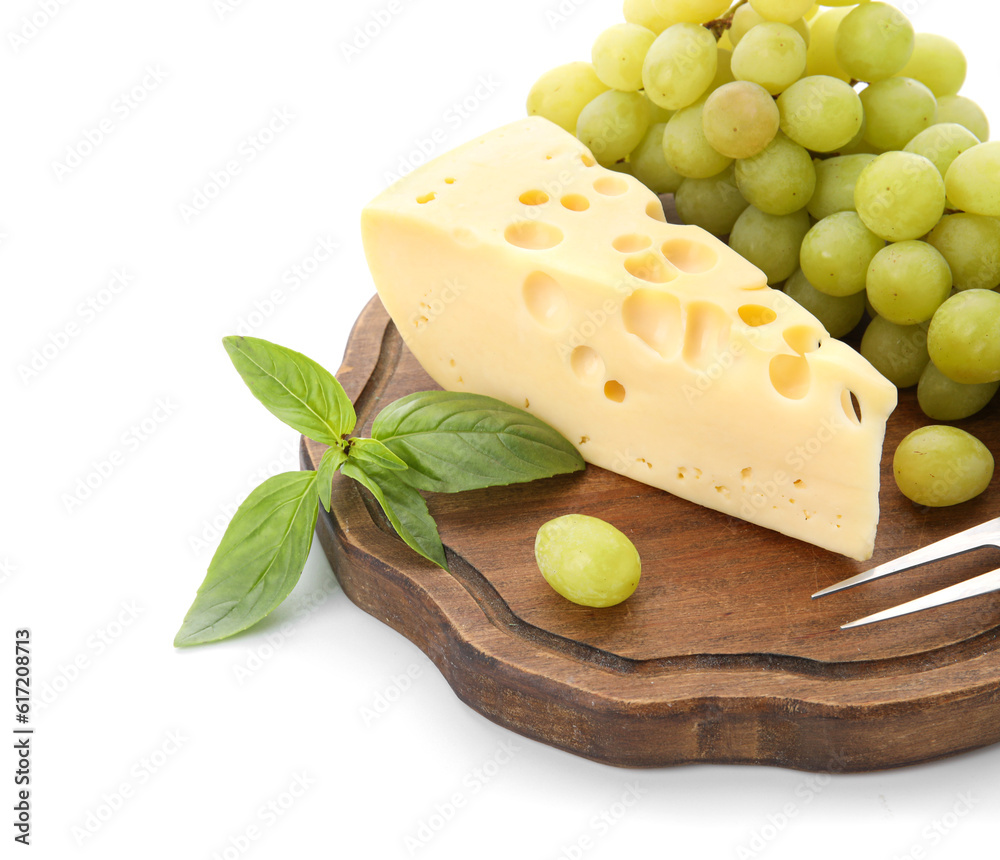 Wooden board with tasty Swiss cheese and grapes on white background