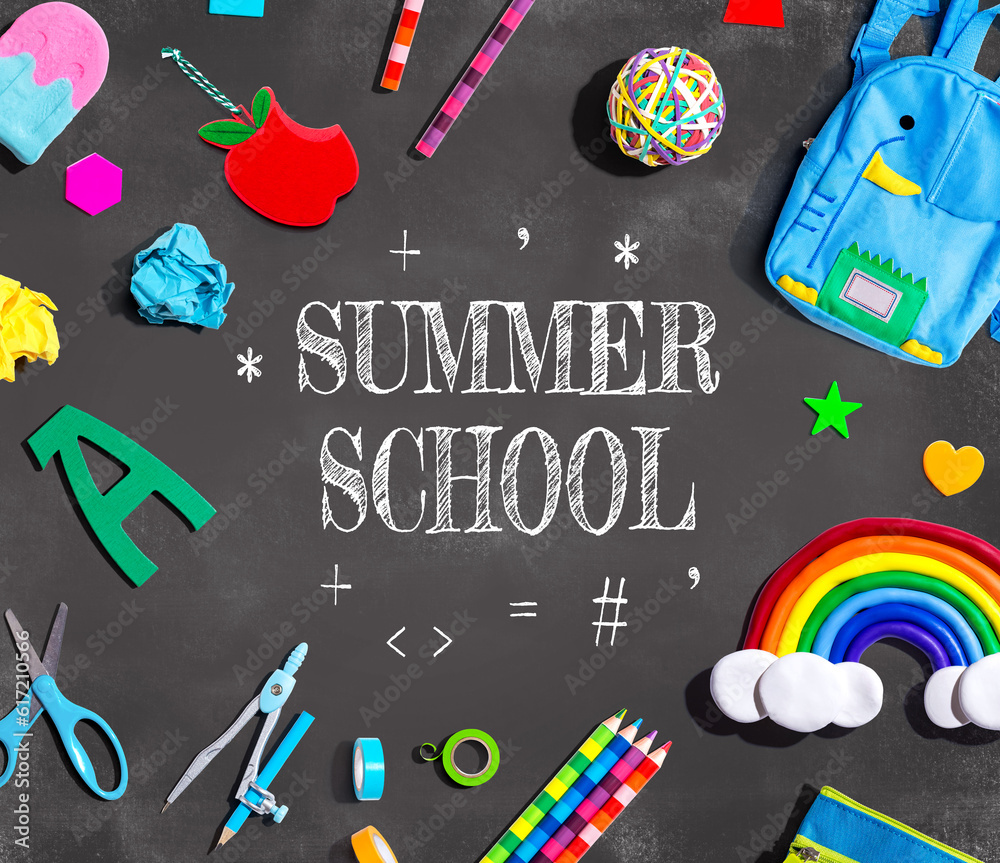 Summer School theme with school supplies on a chalkboard - flat lay