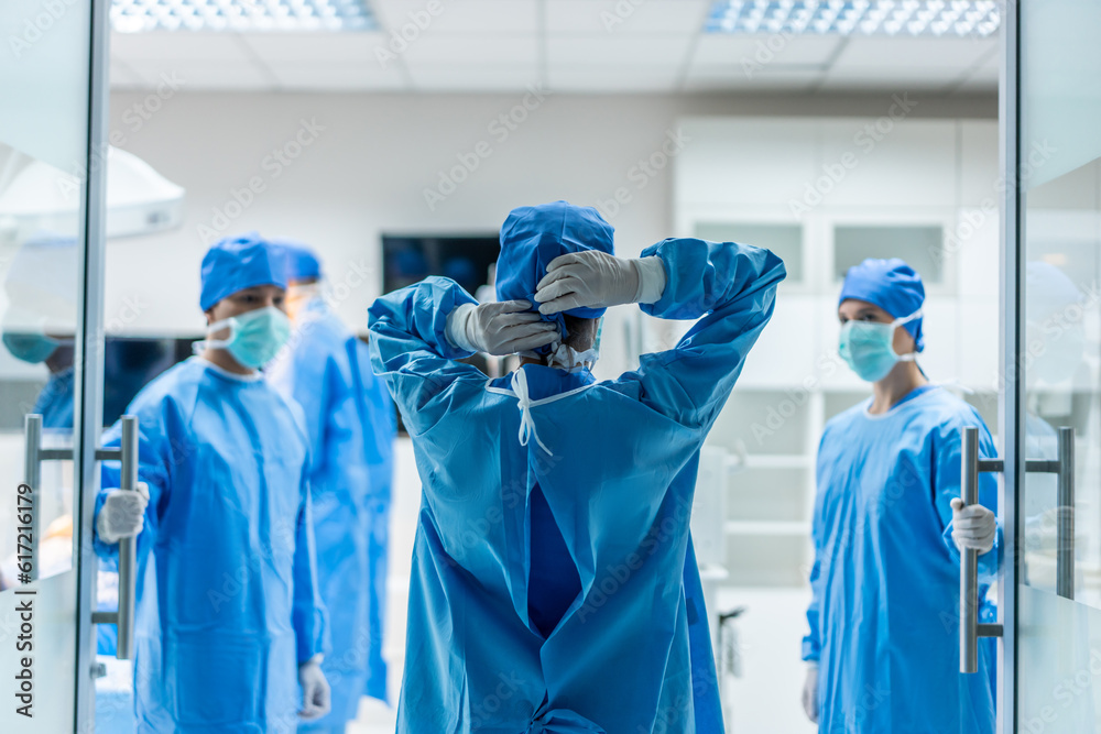 Professional doctors performing surgical operation in operating room. 